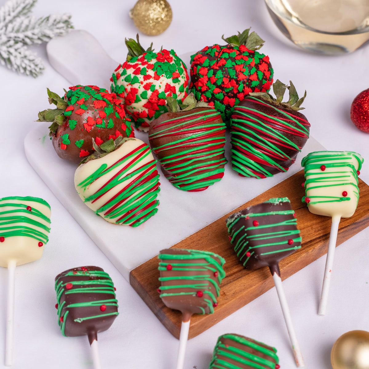 Holiday Hand-Dipped Belgian Chocolate Strawberries & Cheesecake Pops